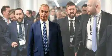 Nigel Farage and a security team