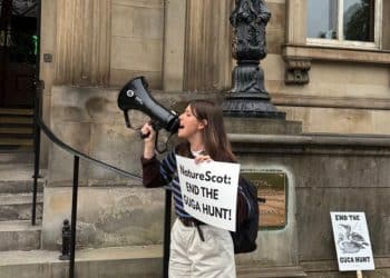 Devon Docherty of Protect the Wild protesting against NatureScot at the Biodiversity + Business Live conference at the Royal College of Physicians in Edinburgh