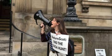 Devon Docherty of Protect the Wild protesting against NatureScot at the Biodiversity + Business Live conference at the Royal College of Physicians in Edinburgh