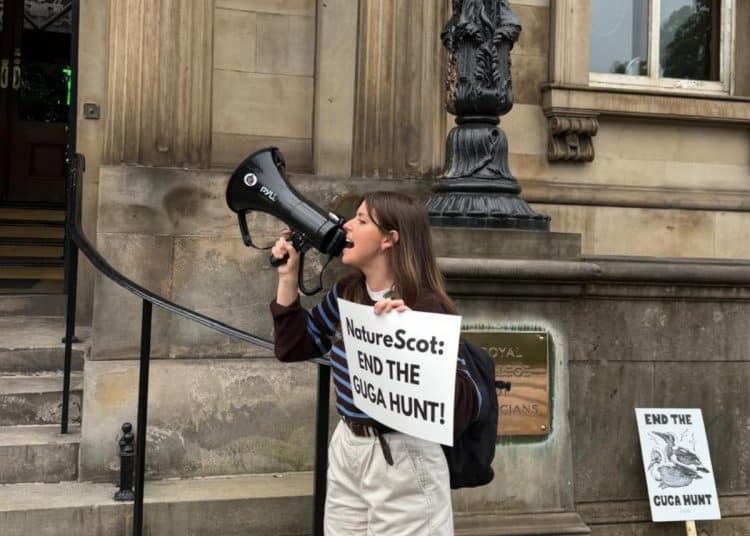 Devon Docherty of Protect the Wild protesting against NatureScot at the Biodiversity + Business Live conference at the Royal College of Physicians in Edinburgh