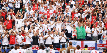 England v Ghana at the Boston Stadium, on 23 June 2026. England fans applaud the players after the match from the fans. It's a vivid array of flags, England shirts and red and white