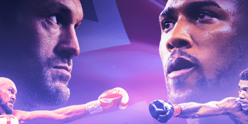A designed graphic featuring head shots of a serious-looking Tyson Fury (left) and Anthony Joshua (right) above them in fighting stances with a Union Jack flag in the background