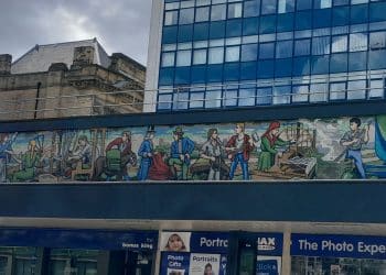 A mural from Huddersfield showing the past jobs of local people.