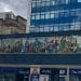 A mural from Huddersfield showing the past jobs of local people.