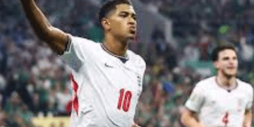 England player Jude Bellingham celebrates scoring their first goal with one hand in the air and his index finger making a 'number 1'