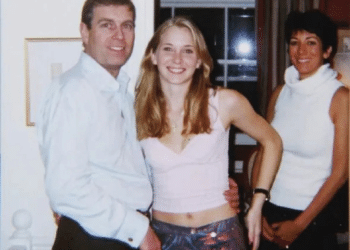 The infamous photo of Prince Andrew with his arm around Virginia Giuffre, 17, in 2001 with convicted sex offender, Ghislaine Maxwell, in the background smiling at the cameraperson too