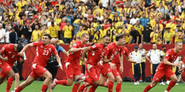Switzerland team reacts to Vargas' winning penalty to send them to the quarter finals