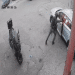 Screenshot of CCTV footage showing an Israeli officer pushing his weight against the car door and inside the vehicle is lit up orange as the grenade has exploded.